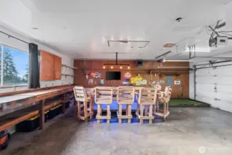 3 car garage already set up for entertaining. Work bench and storage