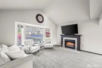 Complete with vaulted ceilings & a cozy fireplace