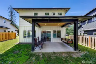 Covered back patio with access directly from the living room for easy entertaining