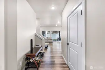 Garage access to the right, entry way has plenty of room for organization options - sitting bench, storage, decor table and/or coat hooks!