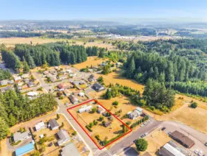 Large, corner lot is across from the grade school.