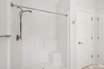 First ensuite bathroom with walk in shower and "linen" closet