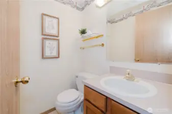 A half bath on the main level, off the living room area for guests.