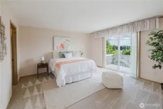 The primary bedroom with ensuite bath and private deck.
