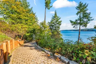 The start of the beginning of the paver path down to the beach with retaining wall, drainage at cross sections and at first turn a location landing for leaving your utility vehicle, adding furniture to take in views or a bench to rest and enjoy!