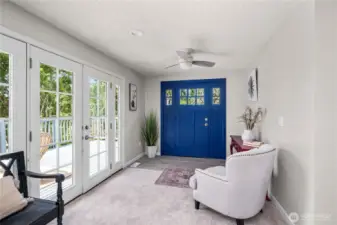 2 french doors allowing access to the deck and allows wonder light to fill the home