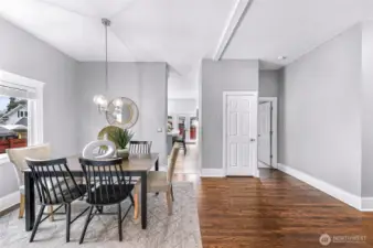 Full size dining room off living room and leading into the kitchen.