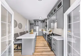 Doors from kitchen leading to newer composite deck.