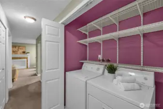 Washer & dryer included, neatly tucked behind folding bifold doors.