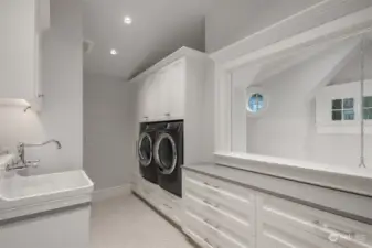How very clever they were to put a window in this laundry room overlooking the entry.  It lets in tons of light and is a surprising and pretty outlook.