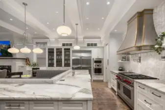 If ever there was a swoon worthy kitchen, this is it.  The stone is gorgeous, the tile beautiful, the French wire in the custom cabinets just right and the commercial appliance package is as good as it gets!  We love the built in eating banquette.