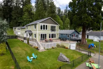 Here you can see the whole package!  Main house with that expansive deck, lower boathouse and the detached garage with ADU apartment above located just across the private access road.  5 extra deep garages in all!