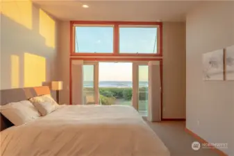 The Upper Primary Suite offers a view few can boast of. Spacious with large walk in closet as well as direct access to upper deck and stairs down to the dune and beach.