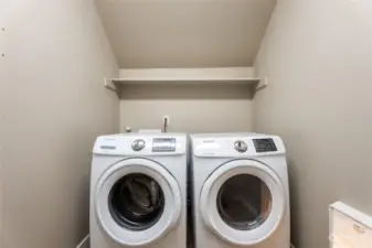 Laundry room next to the half bathroom