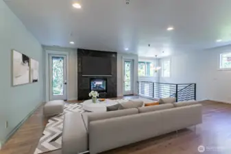 Living space with doors to the front deck looking out to Coal Creek