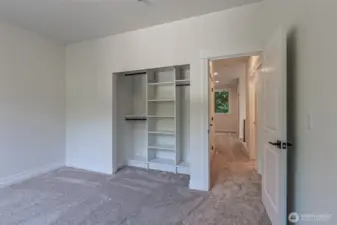 Both additional upstairs bedrooms feature closet built ins