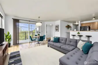 Note Virtually staged.  Living room and dining area boasts walls of windows.