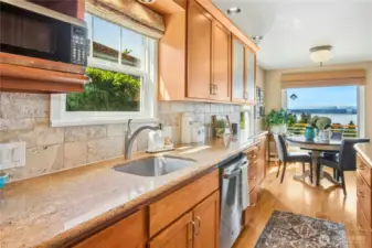Custom cabinetry & slab surfaces and VIEW