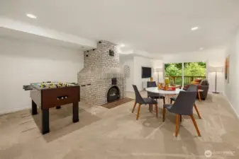 Truly spacious, this area features a cozy wood-burning fireplace and ample room for lounging, hobbies, or multi-purpose living.