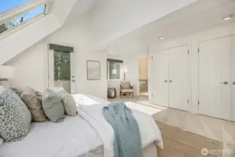 Freshly painted primary bedroom with double closets for ample storage. All west-facing windows feature remote-controlled blackout blinds for comfort and privacy.