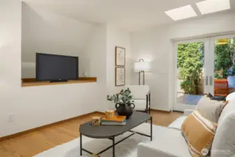 Bright and versatile space just off the kitchen, with natural light from adjacent French doors and easy access to the nearby entry. Currently a casual hangout area, but easily converted back to an in-kitchen dining space.
