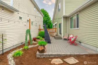 Yard is mostly hardscaped for ease of maintenance.