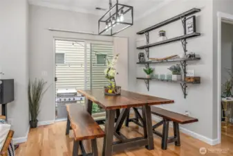 Dining room as seen from kitchen. Access to yard beyond.
