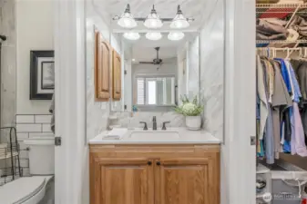 Bathroom vanity separated from the shower allow multiple people to get ready simultaneously. Large walk-in closet complete this primary suite.