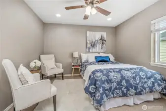 Second bedroom upstairs. This is a queen size bed and still space for a seating area.