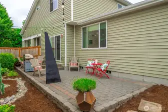 Yard is mostly hardscaped for ease of maintenance.