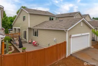Back alley access to garage and driveway parking. Gate access to fenced yard.
