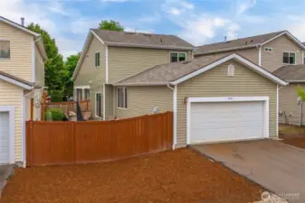 Back alley access to garage and driveway parking. Gate access to fenced yard.