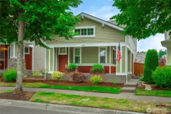 Concrete porch wraps around the full front of house and side all the way to the fenced yard.