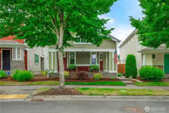 Concrete porch wraps around the full front of house and side all the way to the fenced yard.
