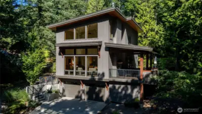Covered deck featuring outdoor gas fireplace. Perfect for entertaining!