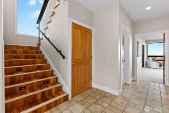 Heading upstairs, notice the beautiful floors that are a mix of Brazilian teak and maple.
