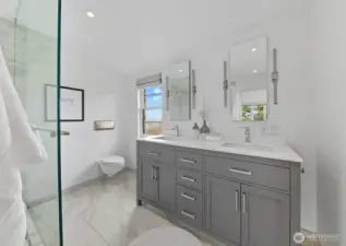 Primary en suite features heated floors and a walk-in closet.
