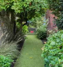 Fully fenced and a lovely side path along the south side of the home.