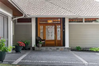 Front of the home with custom front door.  Water Lilies Lithograph