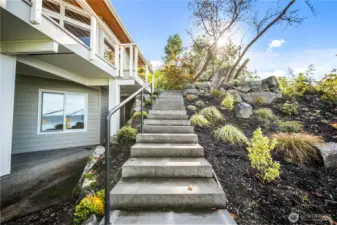 Steps from downstairs covered patio area to upstairs deck.  Perfect for entertaining