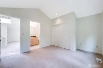 A look from the guest bedroom with the loft space to the left, and the private bathroom in the right.