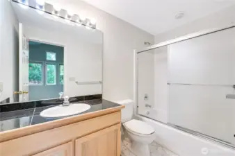 The ensuite bathroom in the upper level guest bedroom awaits your personal touches.