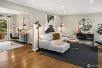 Just behind the living room is a flex space with sliders to the back deck.