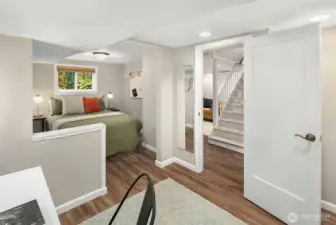 One of two lower level bedrooms. This room has two separate areas, one for sleeping and another for play or study. This bedroom may be non-conforming. Buyer to verify.