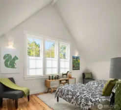 The second of two large, vaulted ceiling bedrooms with huge closets.  South facing windows fill this space with light.