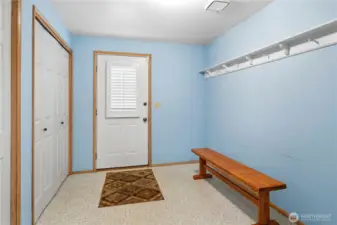 Massive mudroom with hooks, and tons of closet  space for all of your shoes and coats.