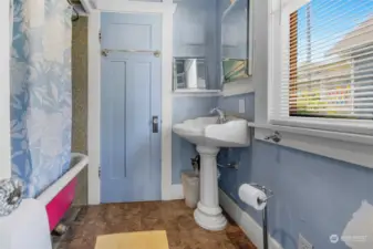 Main bathroom screams "Please remodel me but please leave the pink tub". Or not