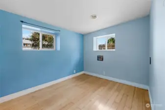 Finished light filled lower bedroom just waiting for your armoire.