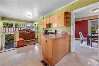 Lots of possibilities to reconfigure this large kitchen space. Wall off the area before the back door to create a private entrance to a potential lower level ADU with private off alley parking.