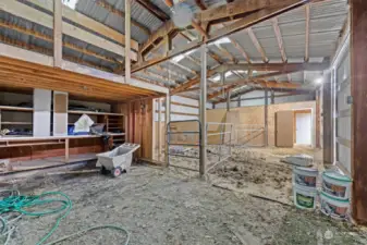 Looking across the stable area toward the workshop end of the shop.